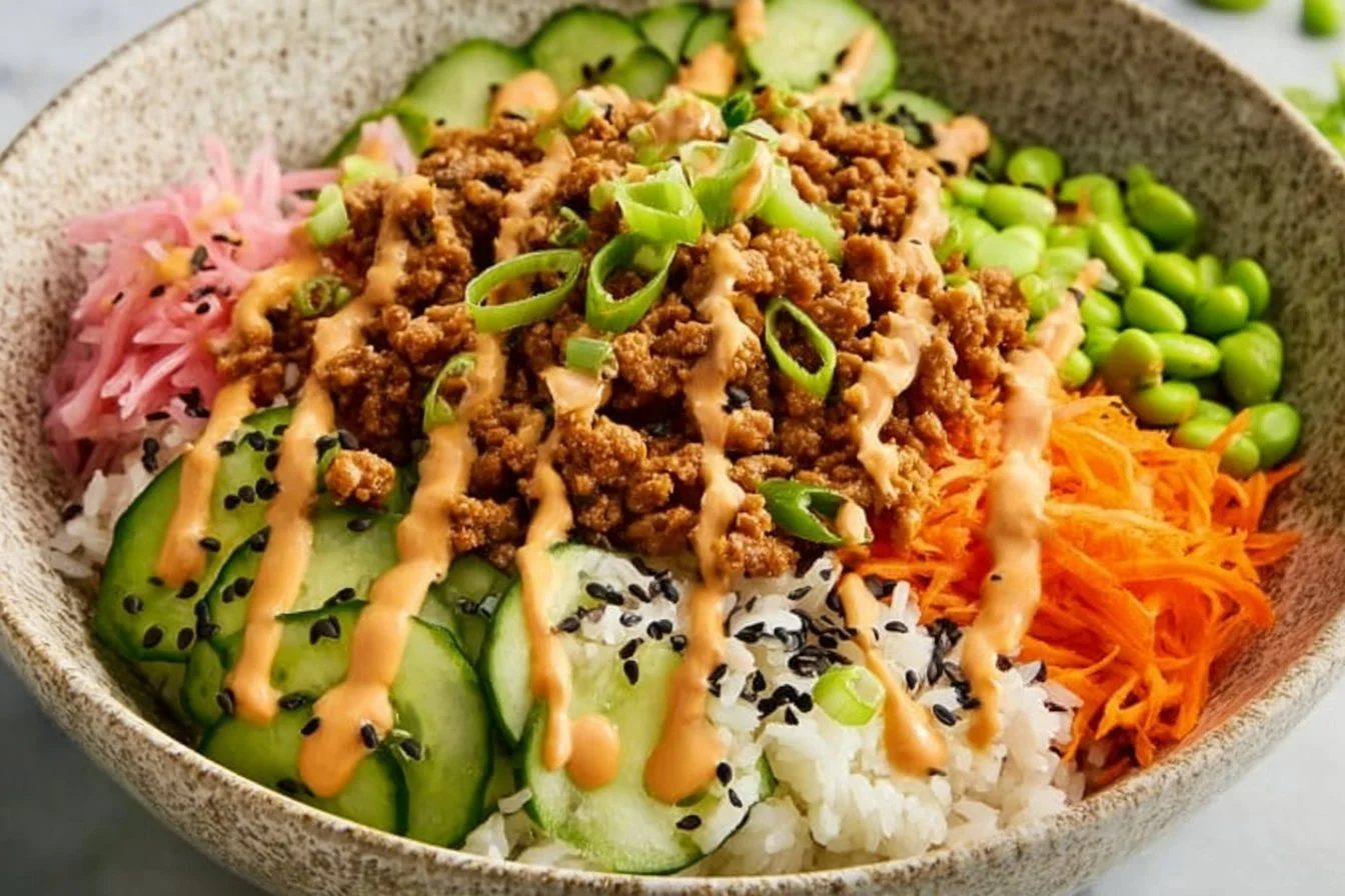 Bang Bang Ground Turkey Bowl topped with fresh vegetables and spicy sauce